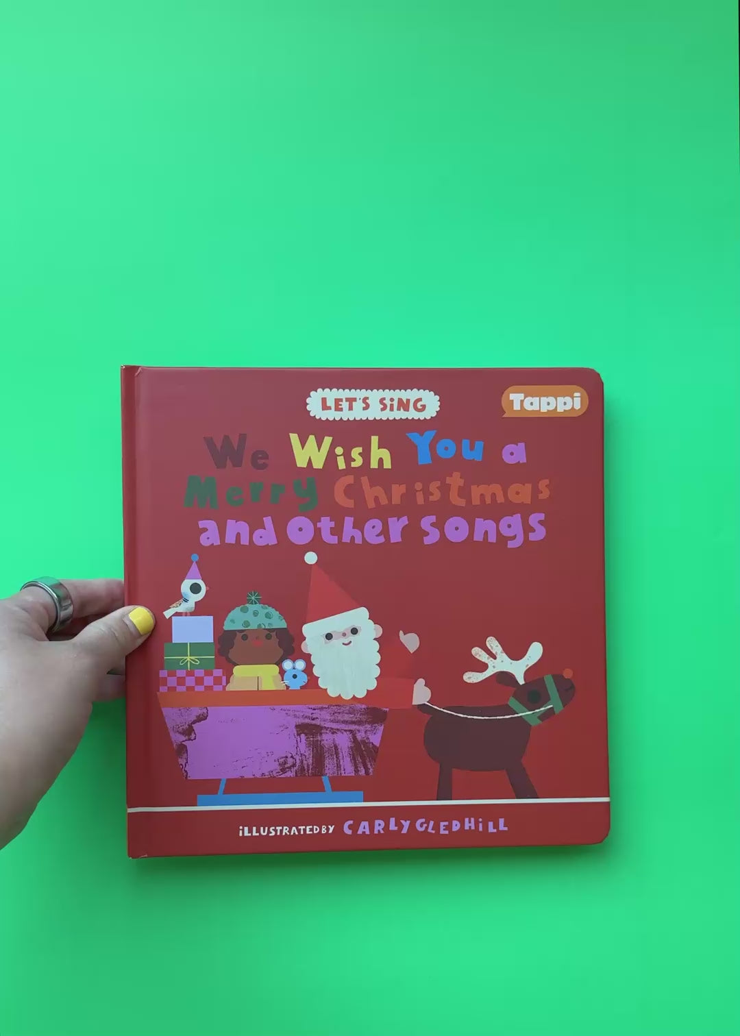 We Wish You a Merry Christmas and Other Songs book overview, demonstrating the Tappi Play Pen.